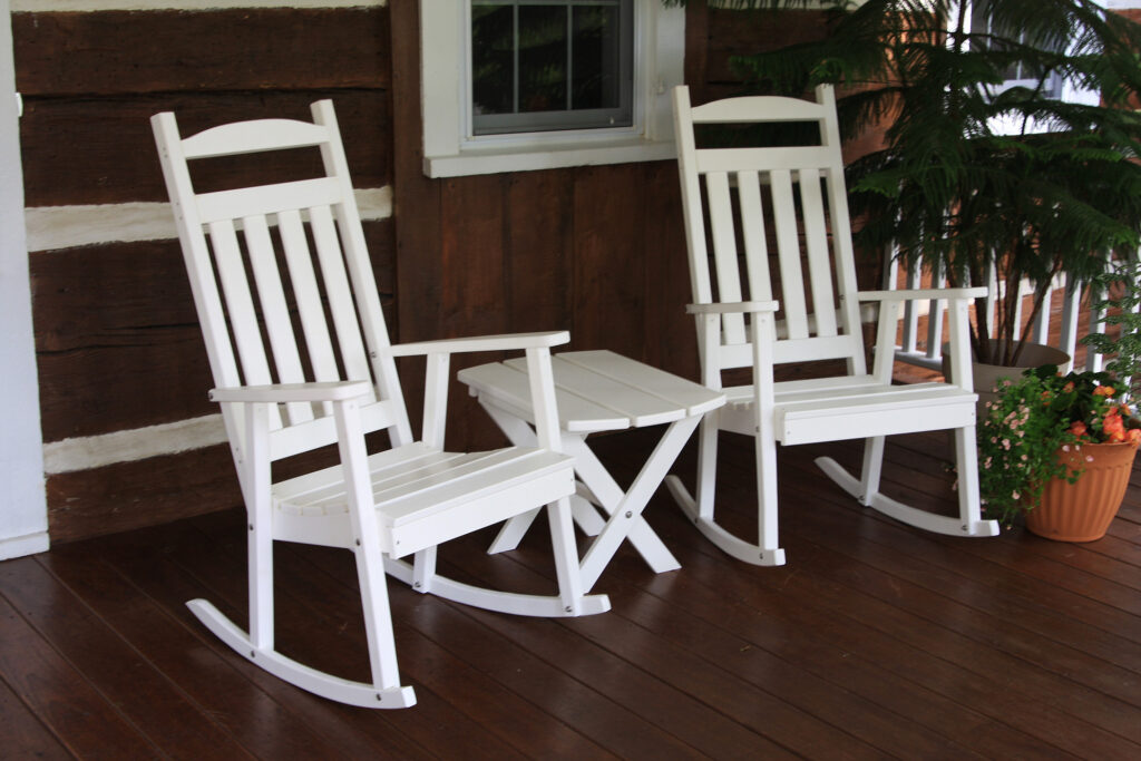 Two White Classic Porch Rocker on a wooden porch