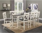 Gathering Table w/ Butterfly Leaf surrounded by chairs in a dining room