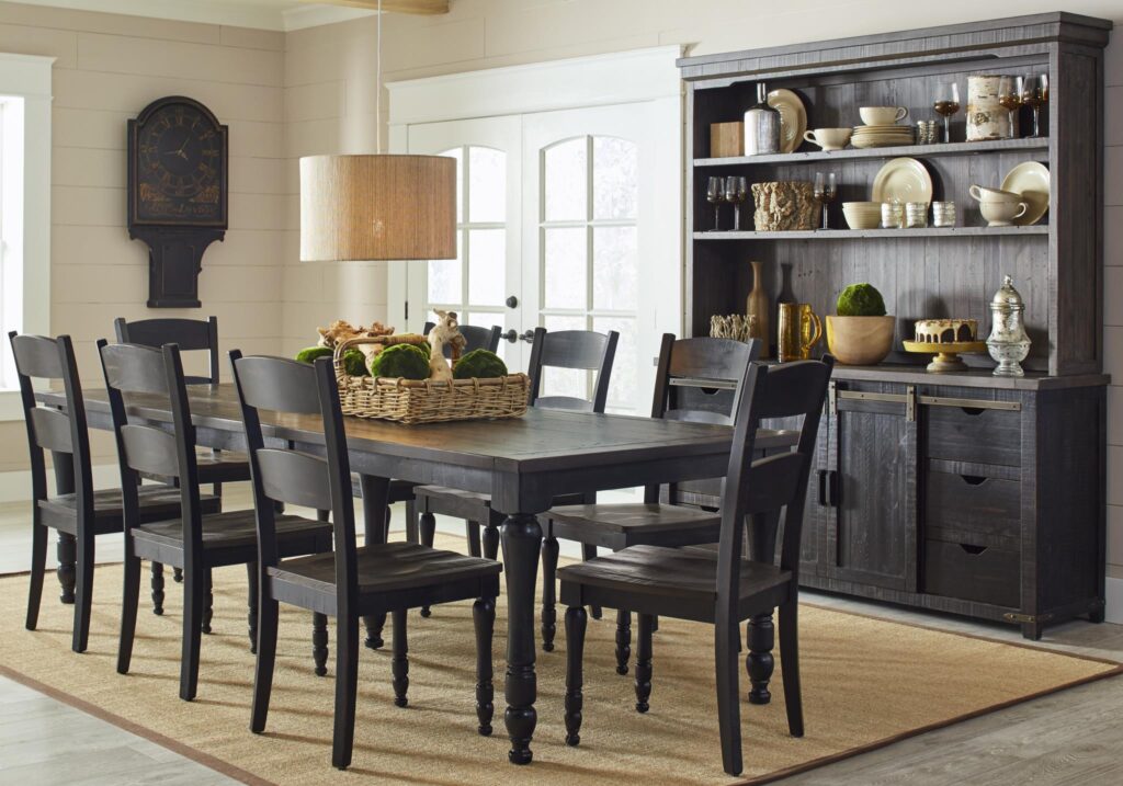 The Madison County Extension Table in Vintage Black surrounded by chairs in a dining room