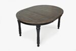 The Madison County Round to Oval Dining Table in Vintage Black in oval shape