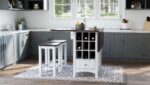 The Asbury Park Counter Drop Leaf Table with two stools surrounding it, in a dining room environment