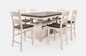 Madison County High/Low Extension Dining Table in Vintage White with chairs surrounding it, in its highest position