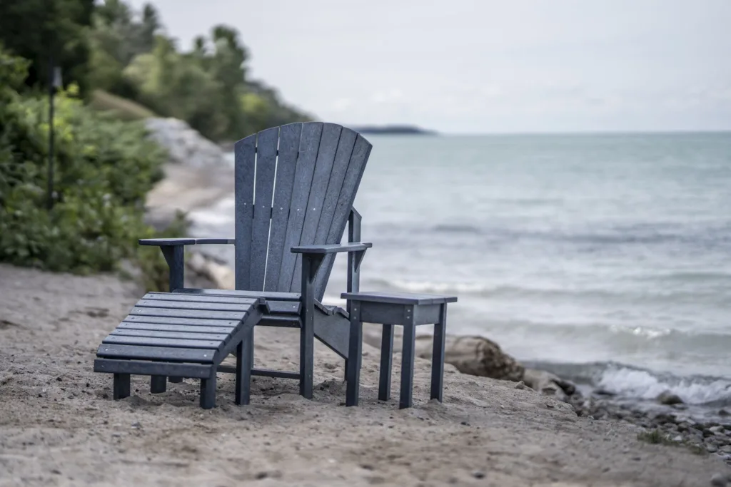 Slate Grey Generations Upright Adirondack Chair with the back facing a beautiful coastline