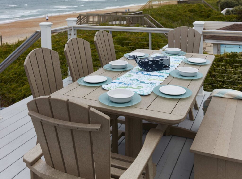 Multiple beige Generations Addy Dining Side Chairs around a table outdoors